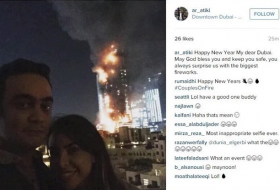 Le selfie d’un couple devant le spectaculaire incendie d`un hôtel de luxe suscite la polémique