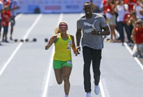 Jeux paralympiques: Bolt, guide d`une athlète malvoyante? Rien ne l`en empêche